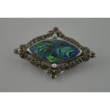 A silver diamond shape brooch set all over with marcasite with a centre of abalone