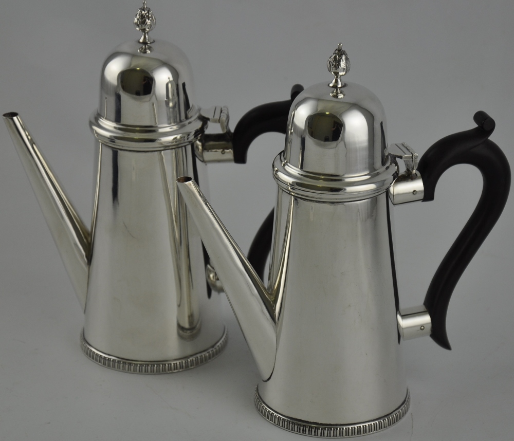 A pair of silver chocolate pots, hallmarked Birmingham 1921 by S. D.