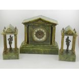 A 19th century gilt metal and onyx clock garniture, the clock of architectural form,