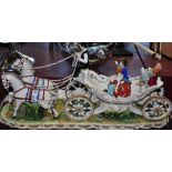 A large German style porcelain centre piece  modelled as a horse and carriage,