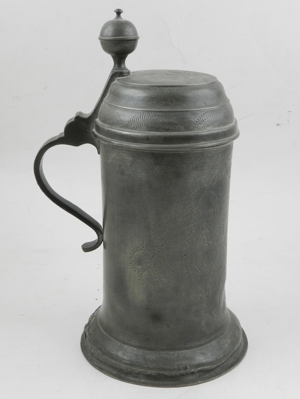 A late 18th century continental pewter lidded vessel, of cylindrical form with a flared base,