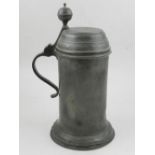 A late 18th century continental pewter lidded vessel, of cylindrical form with a flared base,