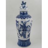 A Chinese blue and white baluster shaped vase, having lid with dog of Fo finial,