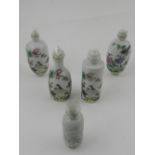 A collection of Chinese hard paste porcelain snuff bottles, decorated in the famille rose palette.