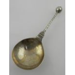 A white metal spoon. L.15cm