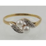 A 9 carat yellow gold, diamond, and pearl crossover ring,