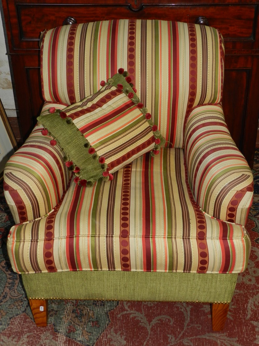 George Smith, England, a Contemporary armchair, upholstered in a multi-coloured striped fabric,