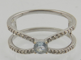 A 9 carat white gold, diamond, and aquamarine ring.