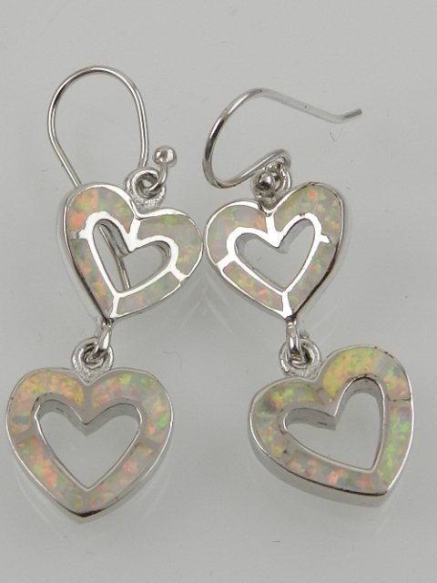 A pair of silver and opalite double heart drop earrings.