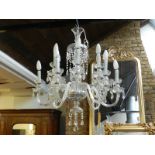 A 19th century style twelve branch crystal glass chandelier.