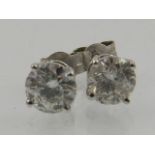 A pair of 14 carat white gold and diamond ear studs, the stones of approx. 1.47 carats combined.