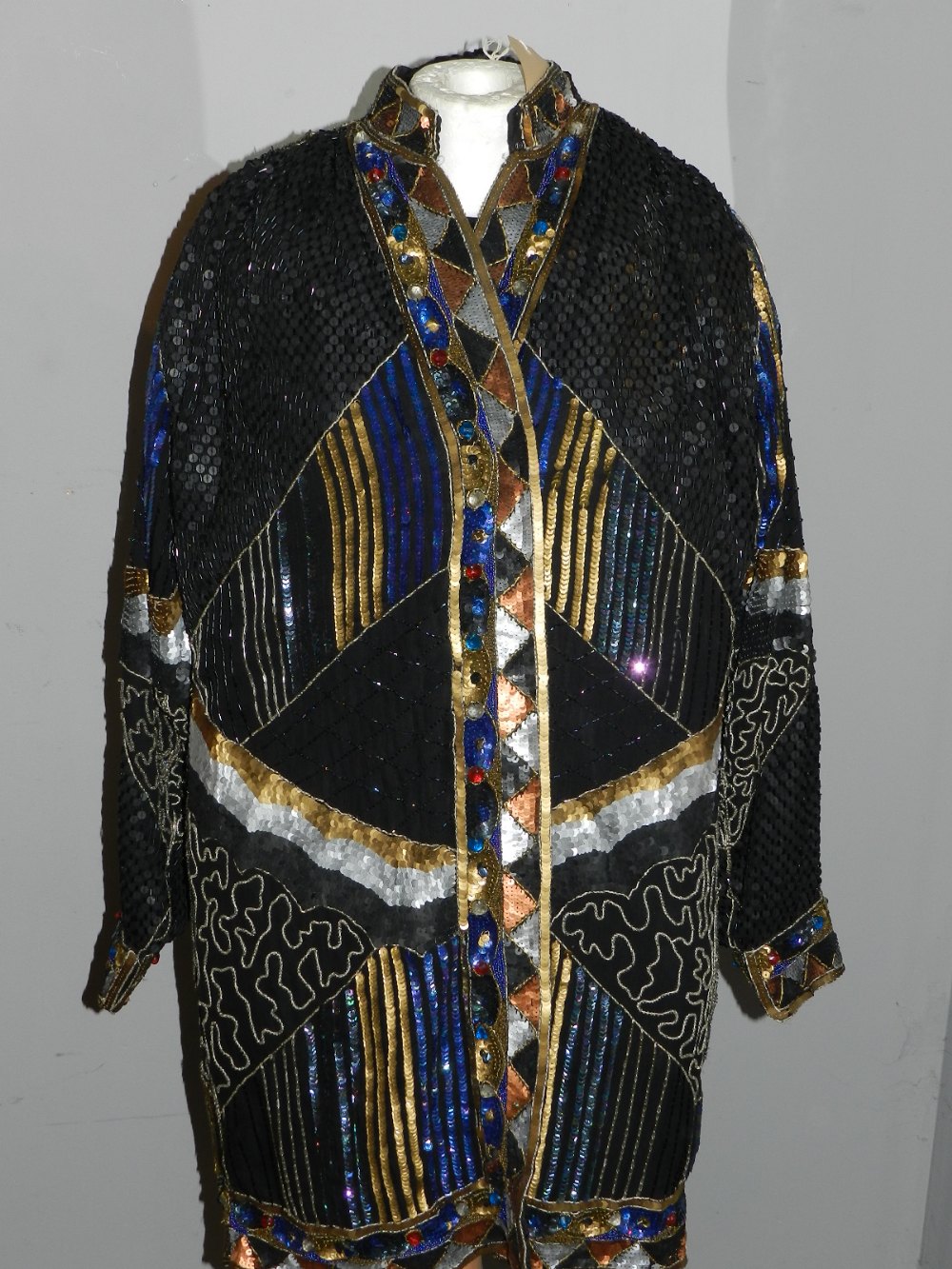 A Frank Usher silk and beaded jacket, approximate size M.