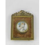 Early 19th Century Continental school, a circular head and shoulder miniature portrait of a lady