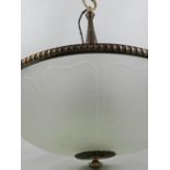 A circular metal ceiling light, having moulded glass shade.
