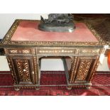 A 19th century ebonised and bone inlaid pedestal desk,