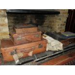 Three graduated vintage tan leather suitcases,