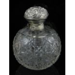 A Victorian silver and cut glass rounded perfume bottle, the collar hallmarked Birmingham.