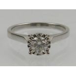 An 18 carat white gold and solitaire diamond ring, the stone of approx. 0.34 carats.