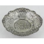 A Dutch white metal tray, having reticulated edge, the centre embossed with battle scene, W.15cm