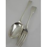 An 18th century silver serving spoon, bears indistinct hallmark for London,
