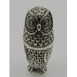 An unusual white metal pincushion in the form of an owl, stamped 'sterling' to base.