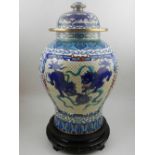 A large Chinese baluster vase and cover, having vignette to each side with dragons chasing pearl