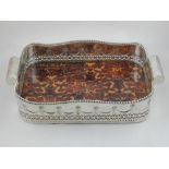A silver plated and faux tortoiseshell tray.