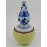A Chinese double gourd porcelain vase, decorated with blue flowers to neck, the body yellow ground.