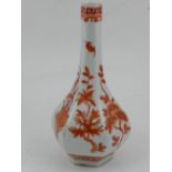 A Chinese hexagonal porcelain vase, decorated in iron red with blossoms,