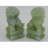 A pair of jade dogs of Fo, seated on plinths. H.