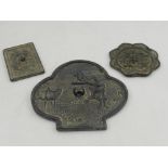 Three Chinese circular bronze mirrors. D.