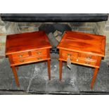 A matching pair of 20th century yew wood bedside tables, having two short above one long drawer,