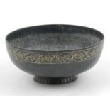 A 19th century Indian bowl, inlaid with white metal floral border to edge. H.6cm.
