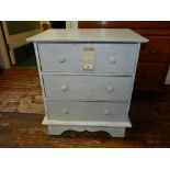 A Contemporary white painted and distressed chest of three long drawers,