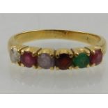 A yellow metal 'Regard' ring, set ruby, emerald, garnet, amethyst, ruby, and diamond,