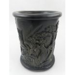A Chinese carved wooden brush pot.