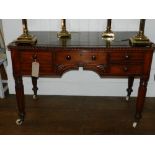 A 19th century padauk wood writing desk, having single drawer flanked by four short drawers,