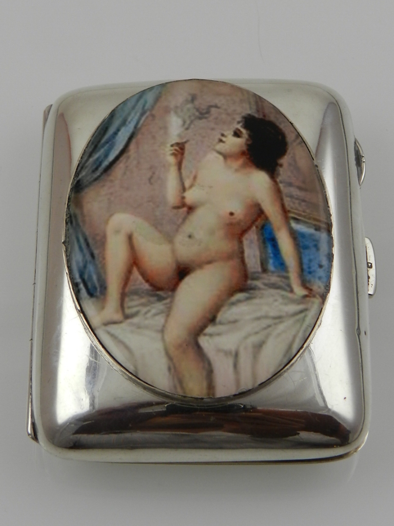 A silver card case, hallmarked Birmingham, set with later enamel plaque depicting a nude female.