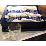 A boxed set of six Rowton crystal tumblers etched with a figure of a golfer at progressive stages