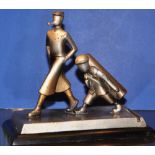 An unusual 1950s cold painted spelter table lighter modelled as a golfer and caddy