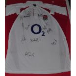 A framed 2005 England rugby shirt with 10 signatures include Martin Johnson and Will Carling