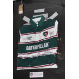 A framed 2010 Leicester tigers rugby shirt,