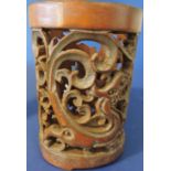 A Chinese bamboo brush pot with perforated decoration of dragons, H14.