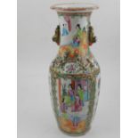 A Chinese Canton style shouldered vase, decorated in the famille rose and verte palettes with