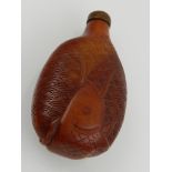 A Chinese resin snuff bottle, decorated with a fish swimming amongst waves. H.10cm