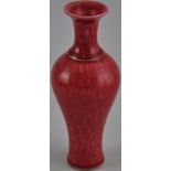 A Chinese red glaze vase, bears a single character mark to the base, H19.