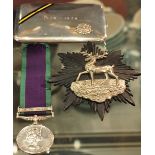 An enamelled silver Bedfordshire and Hertfordshire regiment commemorative cigarette case,
