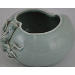 A light celadon, peach shape water pot,
