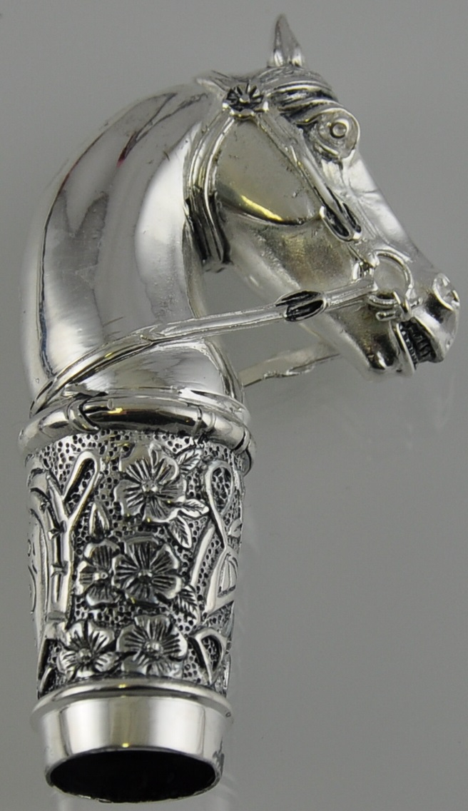A horse head walking cane handle stamped 800