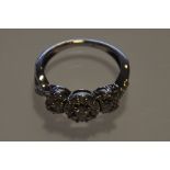 A diamond cluster illusion ring, the multi claw set stones of approx 0.